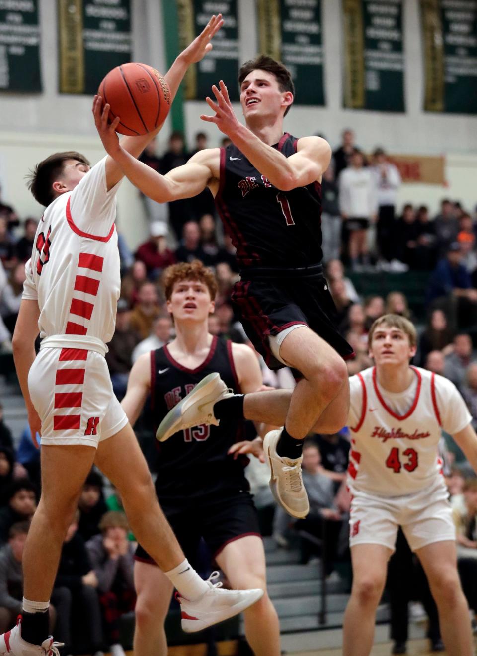 De Pere senior Johnny Kinziger (1) was named co-recipient of the Mr. Basketball Award on Friday.