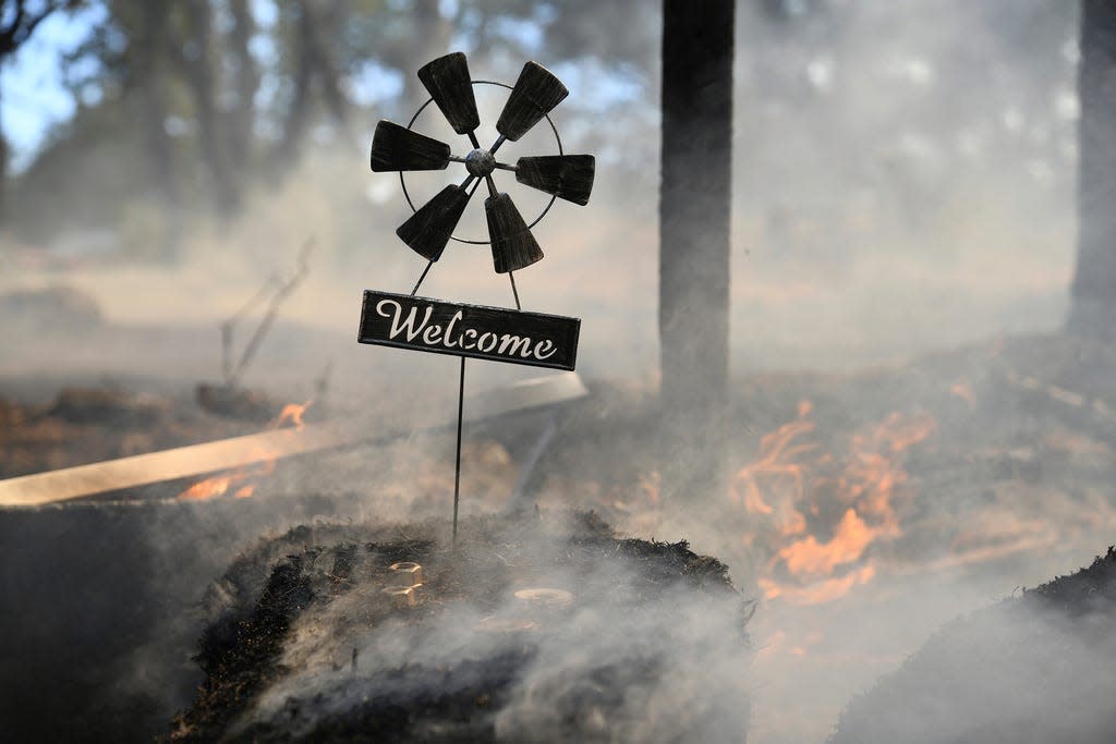 Firefighters managed to save this home along Troost Trail in California's Nevada County.