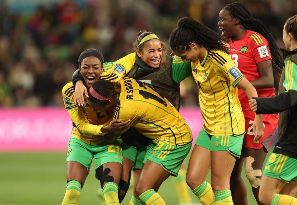 The Jamaican team celebrating on the field