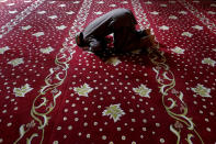 <p>A muslim faithful prays during the Eid al-Adha holiday at the Selimiye mosque, until the 16th century known as the Cathedral of St Sophia, or Agia Sofia, in the Turkish Cypriots breakaway area at northern divided capital of Nicosia, Cyprus, Friday, Sept. 1, 2017. (Photo: Petros Karadjias/AP) </p>