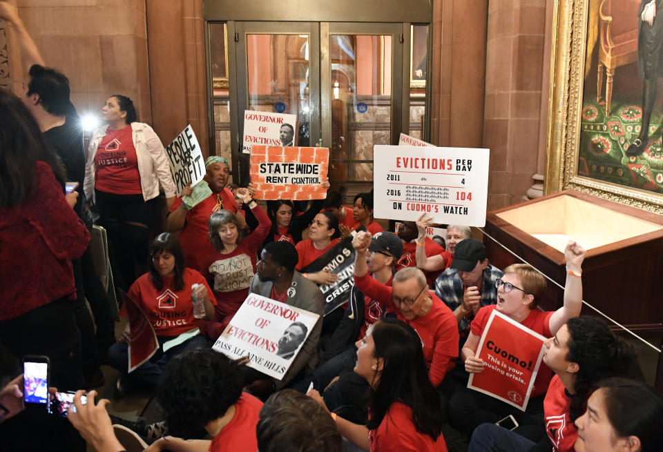 Tenants and members of the Upstate Downstate Housing Alliance from across the state, demand New York Gov. Andrew Cuomo and state legislators pass universal rent control legislation that would strengthen and expand tenants rights across the state of New York before rent laws expire on June 15th during a protest rally at the state Capitol Tuesday, June 4, 2019, in Albany, N.Y. (AP Photo/Hans Pennink)