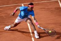 Rafael Nadal of Spain hits a return to Steve Johnson of the US during the Madrid Open, at the Caja Magica (Magic Box) sports complex, on May 6, 2015