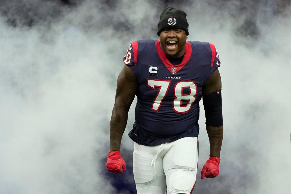 FILE -Houston Texans offensive tackle Laremy Tunsil (78) is introduced before an NFL football game against the Kansas City Chiefs Sunday, Dec. 18, 2022, in Houston. Laremy Tunsil signed a three-year $75 million extension that makes him the highest-paid left tackle in the NFL and will keep him in Houston through the 2026 season, Wednesday, March 22, 2023. (AP Photo/David J. Phillip, File)