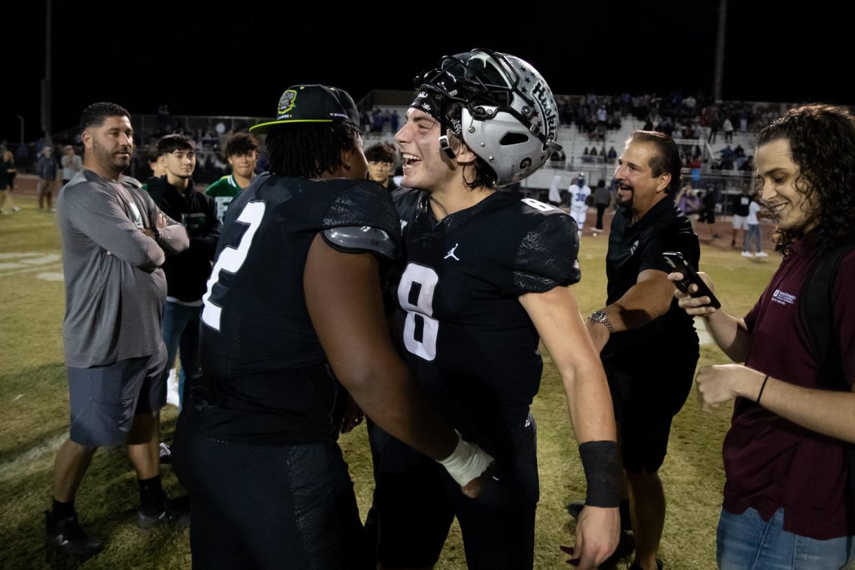 11/12/2021 Chandler, AZ; Hamilton versus Chandler football, Nicco Marchiol (#8) and Dawson Hubbard (#2) celebrate a victory over in-state rival Chandler.