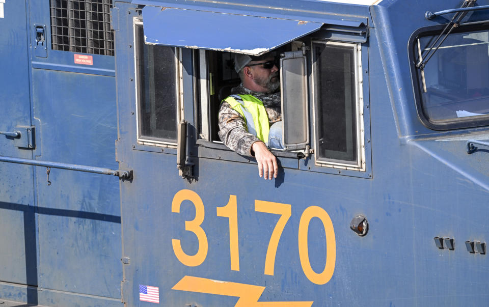 FILE - A locomotive driver, is seen as a locomotive engine arrives at the Selkirk rail yard Wednesday, Sept. 14, 2022, in Selkirk, N.Y. Most railroad workers weren't surprised that Congress intervened this week to block a railroad strike, but they were disappointed because they say the deals lawmakers imposed didn't do enough to address their quality of life concerns about demanding schedules and the lack of paid sick time. (AP Photo/Hans Pennink, File)