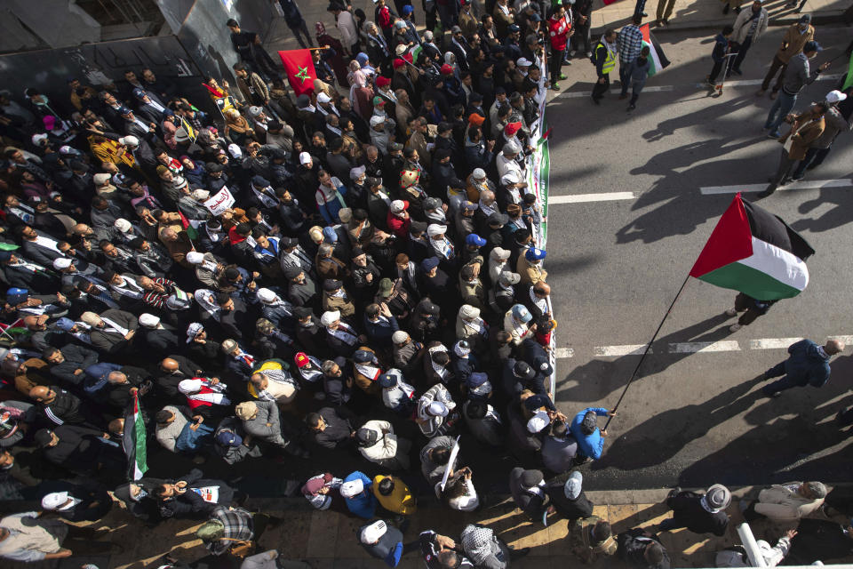 People gather during a demonstration in Rabat, Morocco, Sunday, Feb. 9, 2020. Thousands of Moroccans took part in a march rejecting Trump's Middle East peace plan and in support of Palestinians. (AP Photo/Mosa'ab Elshamy)