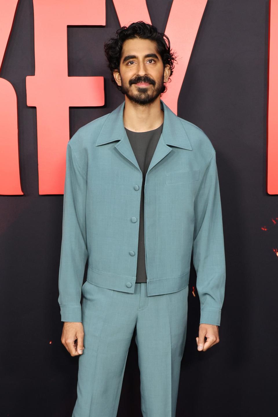 Dev Patel in a light blue suit with matching trousers at a film event