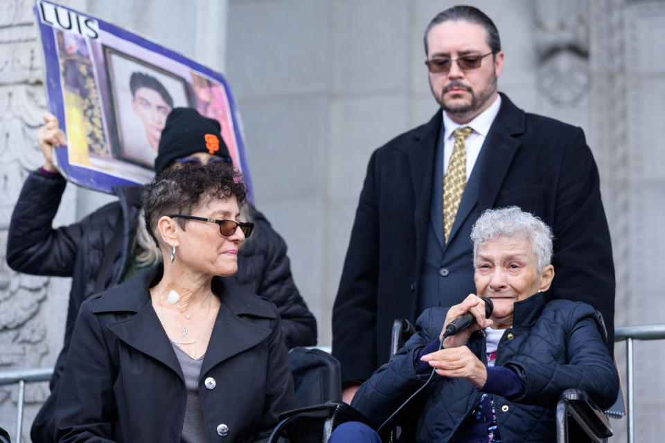 Judy O’Neil, right, speaks at a rally for her son Keita O’Neil as her sister April Green, left, looks on.