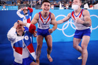 <p>Team ROC's David Belyavskiy, Artur Dalaloyan, Nikita Nagornyy and Denis Abliazin <a href="https://people.com/sports/tokyo-olympics-russian-gymnasts-collapse-in-tears-last-minute-win-mens-team-final/" rel="nofollow noopener" target="_blank" data-ylk="slk:burst into tears after winning gold;elm:context_link;itc:0;sec:content-canvas" class="link ">burst into tears after winning gold</a> in the Men's Team Final at Ariake Gymnastics Centre on July 26.</p>