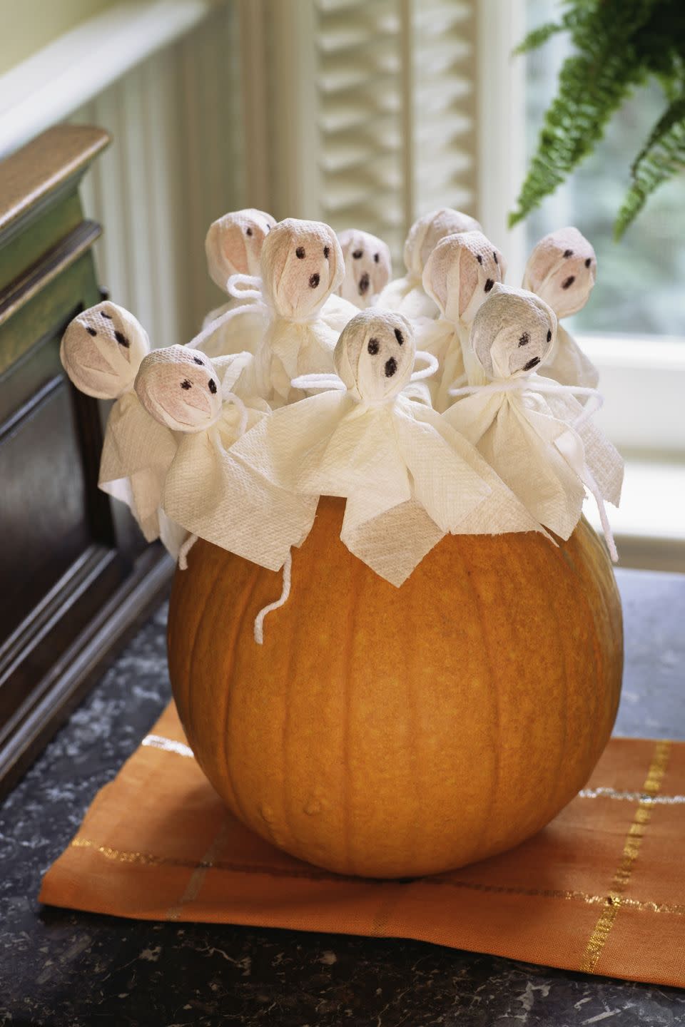 Greet guests with adorable mini-ghost lollipops.