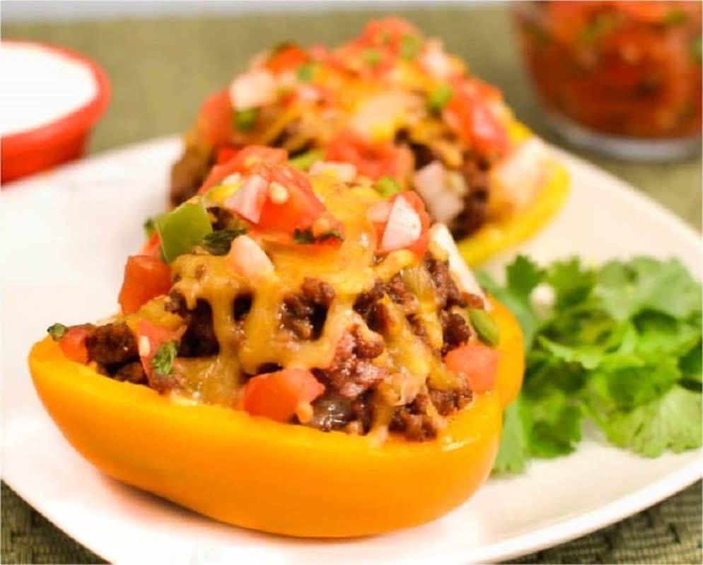 <p>The Cozy Cook</p><p>These healthy, low-carb Taco Stuffed Peppers are oven-baked.</p><p><strong>Get the recipe: </strong><a href="https://thecozycook.com/taco-stuffed-peppers/" rel="nofollow noopener" target="_blank" data-ylk="slk:Taco Stuffed Peppers;elm:context_link;itc:0;sec:content-canvas" class="link rapid-noclick-resp"><strong>Taco Stuffed Peppers</strong></a></p>