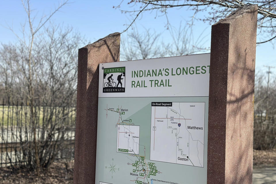 A sign displays a map of the Cardinal Greenways in Muncie, Ind. Wednesday, March 13, 2024. The Cardinal Greenways pathway born from eastern Indiana's abandoned railroad tracks will become a central cog in the Great American Rail Trail — a planned 3,700-mile network of uninterrupted trails spanning from Washington state to Washington, D.C. (AP Photo/Isabella Volmert)