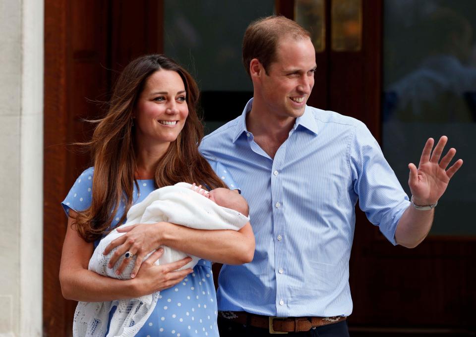 Prince William and Duchess Kate of Cambridge hold their new born son George outside St. Mary's Hospital in London where he was born on July 22, 2013.