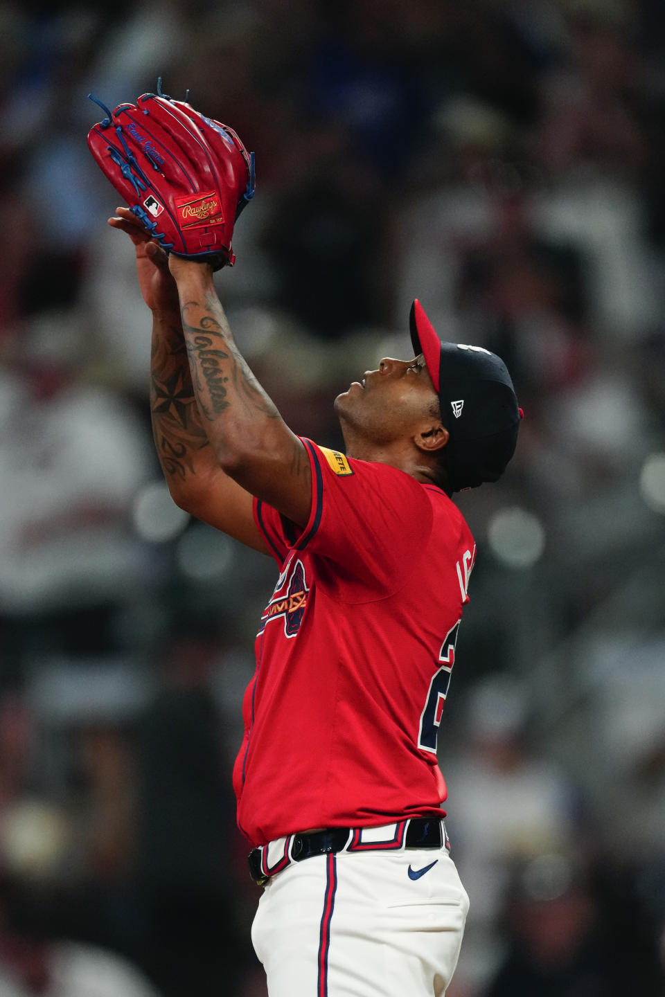 Atlanta Braves pitcher Raisel Iglesias (26) reacts after the final out in the ninth inning of a baseball game against the Tampa Bay Rays Friday, June 14, 2024, in Atlanta. (AP Photo/John Bazemore)