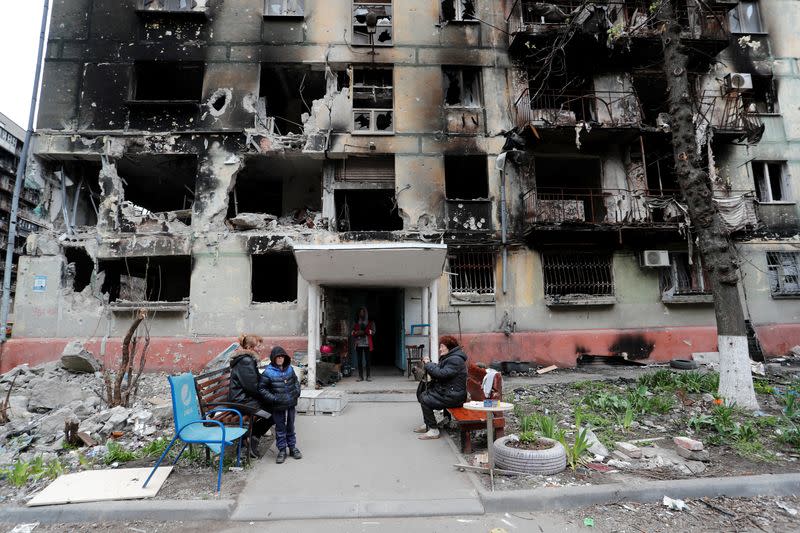 A view shows a damaged residential building in Mariupol