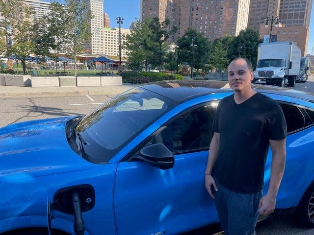 Bob van Acker, 30, who lives in the historic Boston Edison neighborhood of Detroit was charging his Grabber Blue Ford Mustang Mach-E GT at First and Grand River in Detroit.