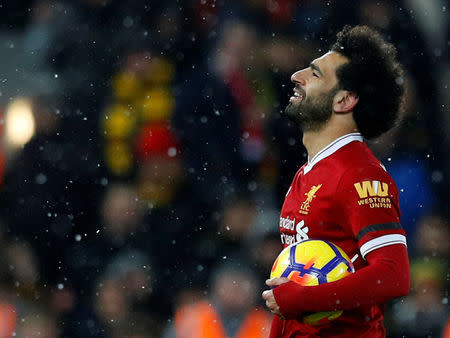 Soccer Football - Premier League - Liverpool vs Watford - Anfield, Liverpool, Britain - March 17, 2018 Liverpool's Mohamed Salah celebrates with the matchball after the match REUTERS/Phil Noble