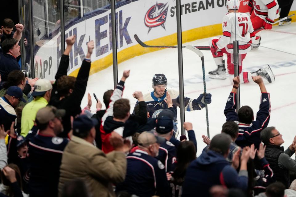 Feb 29, 2024; Columbus, Ohio, USA; Fans celebrate a goal by Columbus Blue Jackets center Cole Sillinger (4) during the second period of the NHL hockey game against the Carolina Hurricanes at Nationwide Arena.