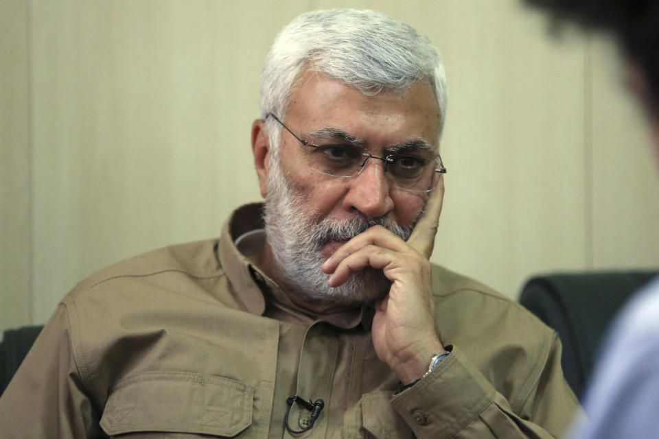 FILE - In this May 29, 2016, file photo, Abu Mahdi al-Muhandis listens to a question during an interview in Fallujah, Iraq. Al-Muhandis, a veteran Iraqi militant who was closely allied with Iran, was killed overnight Friday, Jan. 3, 2020 in a U.S. strike that also felled Iran's top general. Al-Muhandis was the deputy commander of the Popular Mobilization Forces, an umbrella group of mostly Shiite paramilitaries. (AP Photo/Khalid Mohammed, File)
