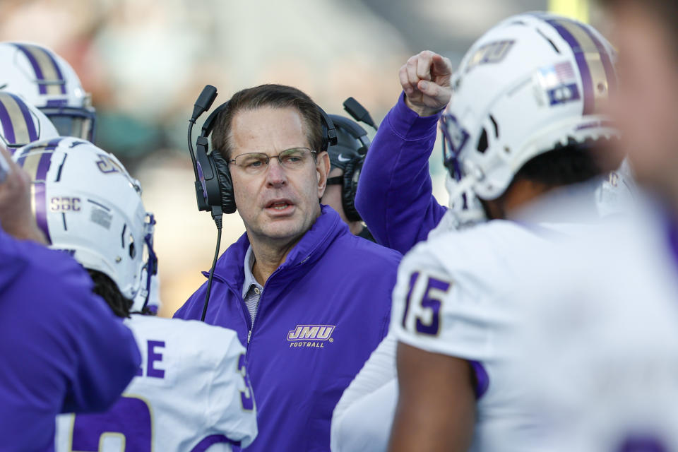 James Madison head coach Curt Cignetti talks to his team during the first half of an NCAA college football game against Coastal Carolina in Conway, N.C., Saturday, Nov. 25, 2023. (AP Photo/Nell Redmond)