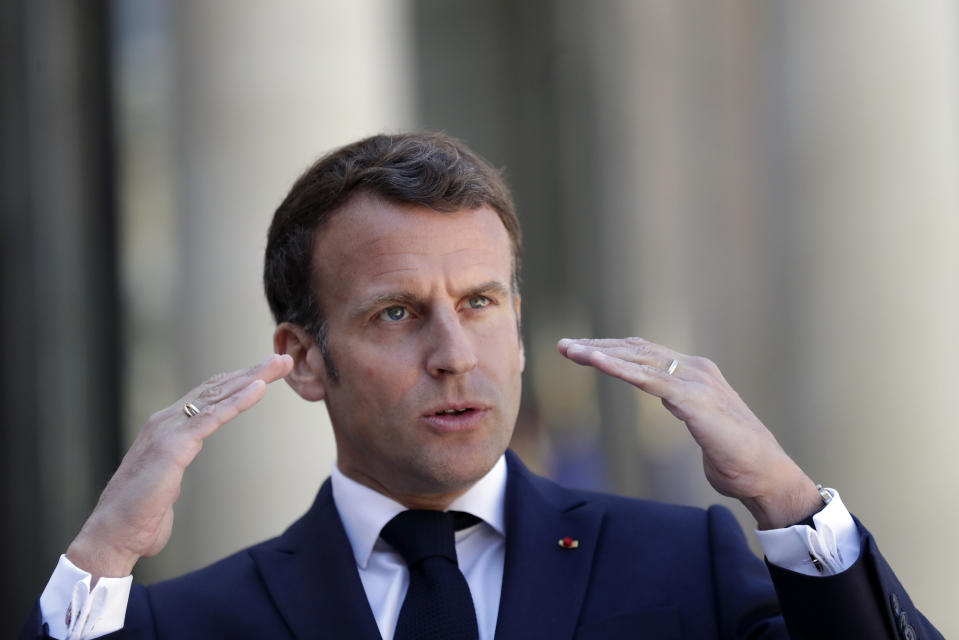 FILE - In this April 27, 2021 file photo, French President Emmanuel Macron delivers a speech prior to a meeting with Republic of Congo's President Felix Tshisekedi, at the Elysee Palace, in Paris. With a year to go to the presidential vote, French President Emmanuel Macron is getting ready for a potential re-election bid by prioritizing reviving the economy and saving jobs. The country is slowly stepping out of its partial lockdown. Macron’s ability to meet the challenge will be key _ as France is among countries worst hit by the pandemic in the world, with over 105,000 virus-related deaths. (AP Photo/Thibault Camus, File)