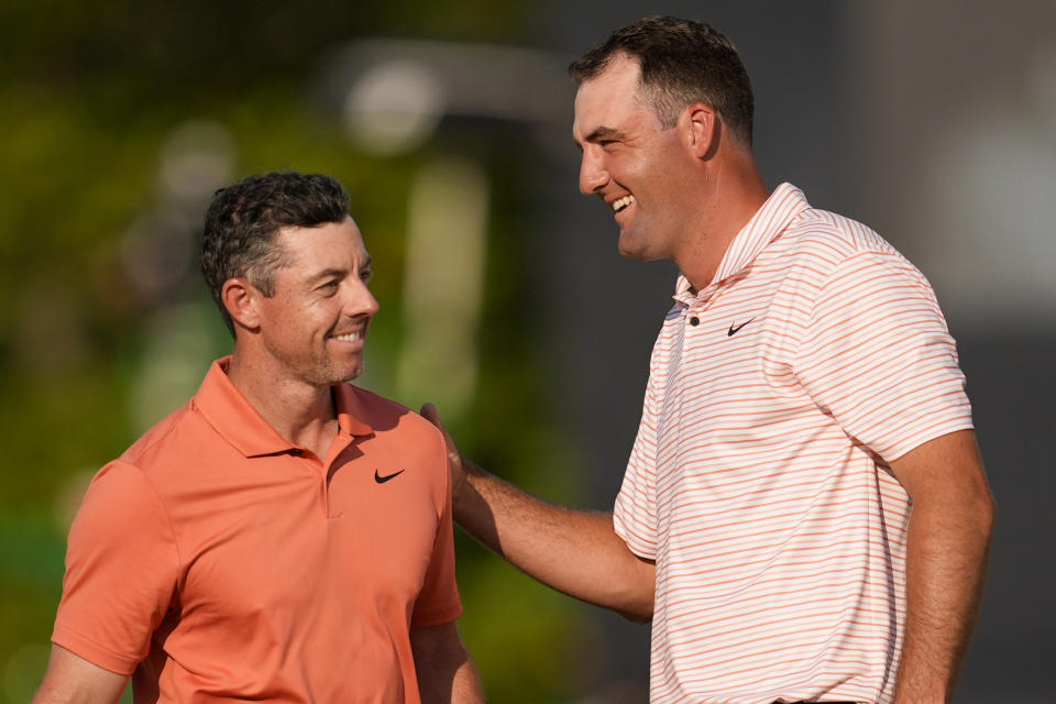 Rory McIlroy, of Northern Ireland, and Scottie Scheffler finish their first round of the U.S. Open golf tournament Thursday, June 13, 2024, in Pinehurst, N.C. (AP Photo/Mike Stewart)