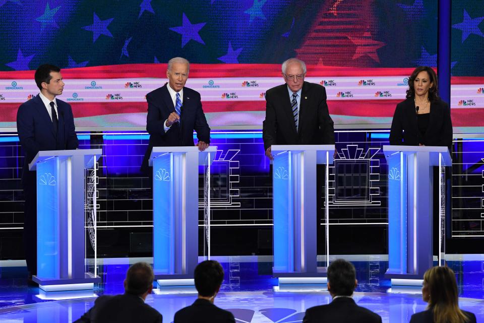 Democratic presidential hopefuls (from left) South Bend, Indiana, Mayor Pete Buttigieg, Former Vice President Joe Biden, Vermont Sen. Bernie Sanders and California  Sen. Kamala Harris speak during the second Democratic primary debate of the 2020 presidential campaign season hosted by NBC News at the Adrienne Arsht Center for the Performing Arts in Miami, Florida.