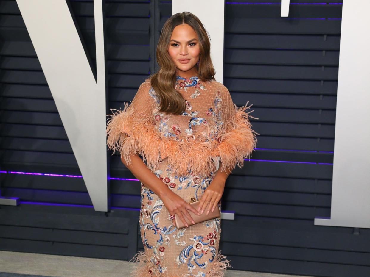 Chrissy Teigen opens up about breastfeeding struggles while asking to ‘normalise formula’  (AFP via Getty Images)