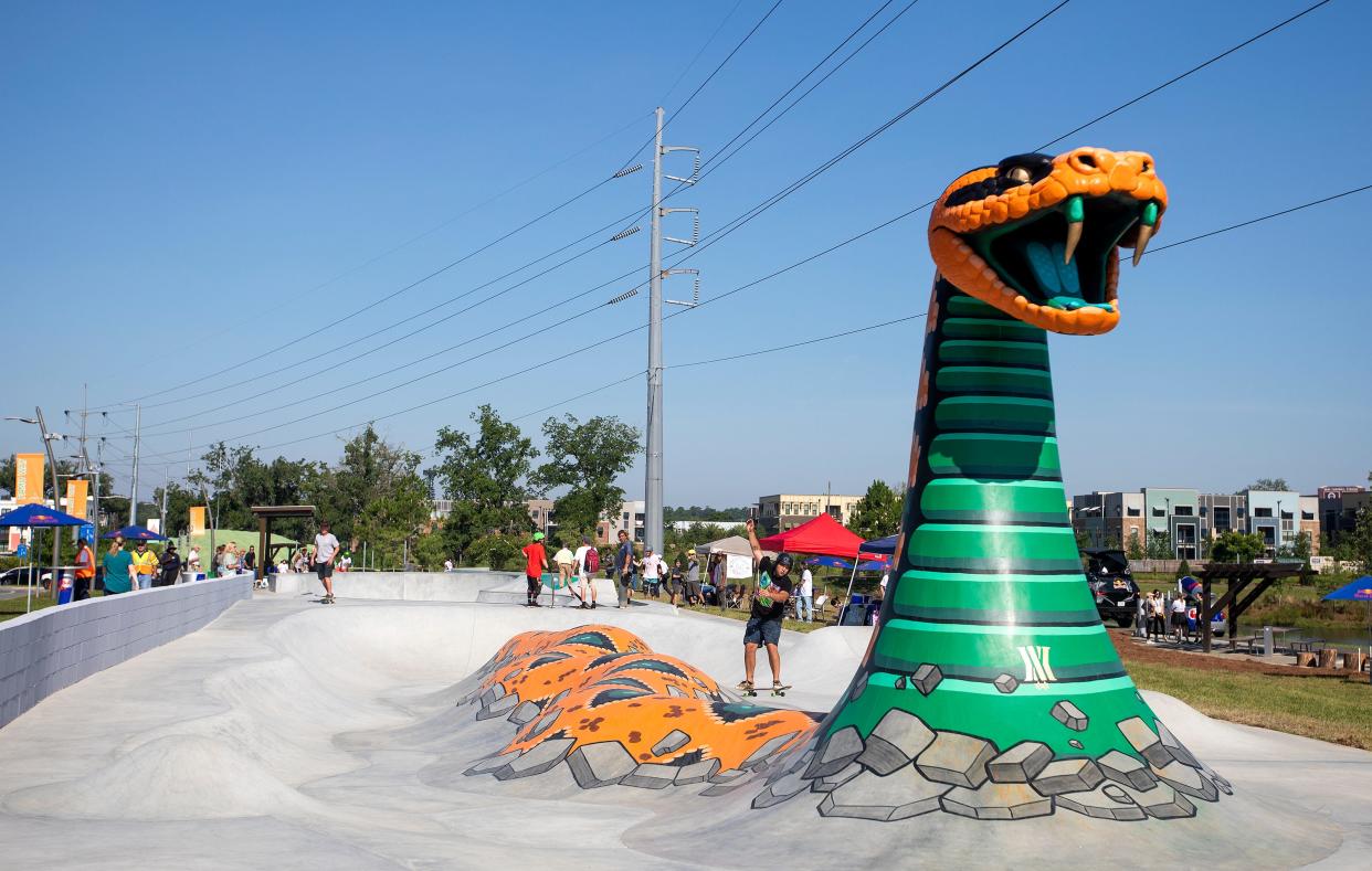 Skaters use the new Cascades Trail Skateable Art Park during its grand opening on Wednesday, June 22, 2022 in Tallahassee, Fla. 