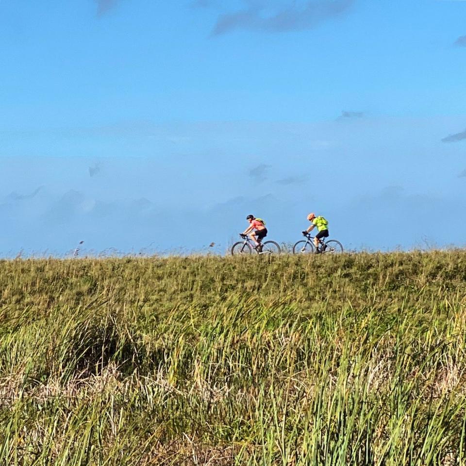 Get away on bike. Palm Beach County offers a multitude of nature trails. These cyclists pedal along the levee in the Loxahatchee National Wildlife Refuge.