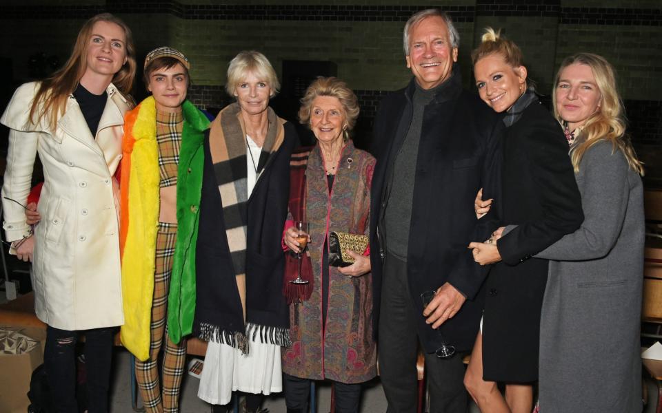 Jane Stevens, centre, at London Fashion Week in 2018 with, l-r, Chloe, Cara, Pandora, Charles and Poppy Delevingne, and Melinda Stevens - Dave Benett/Getty Images for Burberry