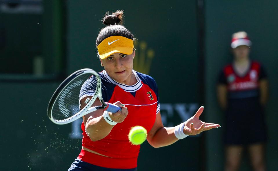 Bianca Andreescu of Canada returns the ball to Anett Kontaveit of Estonia during their round three match of the BNP Paribas Open, Monday, Oct. 11, 2021, in Indian Wells, Calif. 