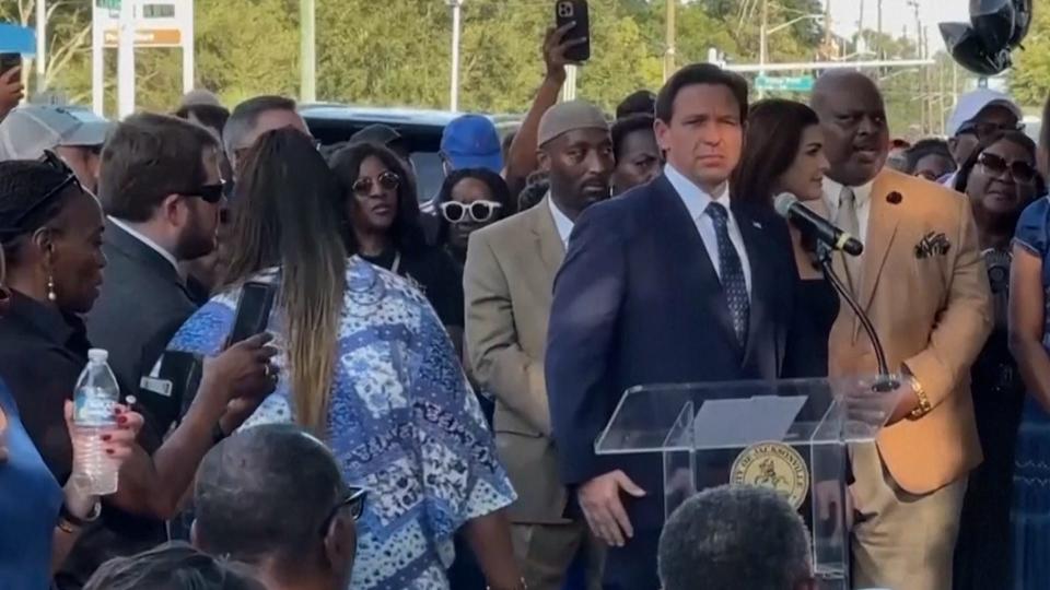 Florida Governor Ron DeSantis was booed at a vigil for Black men killed in a shooting at a Dollar General. The sheriff said it was racially motivated.