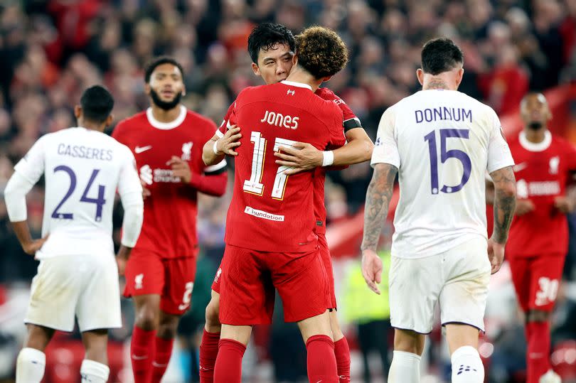 Liverpool's Wataru Endo celebrates scoring his side's second goal with team-mate Curtis Jones during the UEFA Europa League group E match between Liverpool and Toulouse at Anfield on October 26, 2023 in Liverpool, England.