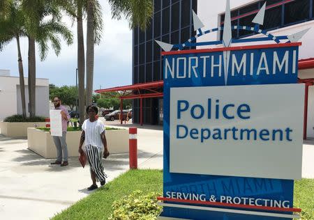 Miami resident Gabriel Pendas, 33, stands alone outside the North Miami police department after a press conference, which provided scant details regarding the police shooting of an unarmed, black behavioral therapist helping an autistic patient who escaped from his group home, in Miami, Florida, July 21, 2016. REUTERS/Zachary Fagenson