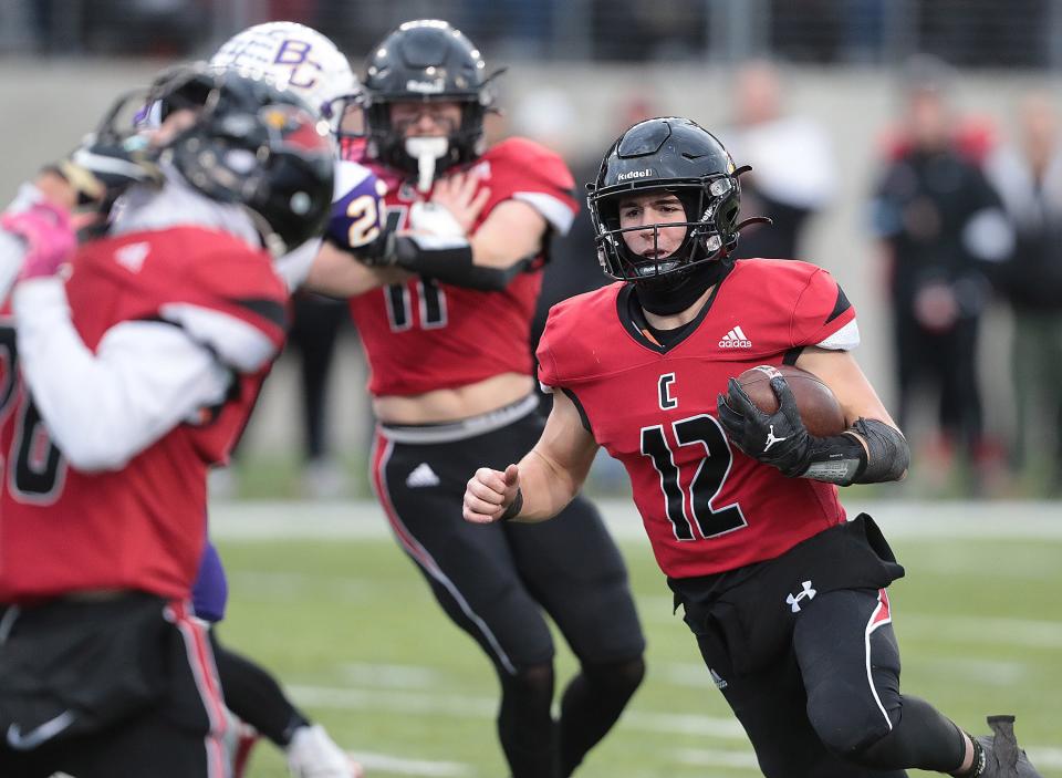 Canfield quarterback Broc Lowry heads into the endzone for a first half touchdown against Bloom-Carroll during their Div. III state final game held at Tom Benson Hall of Fame Stadium in Canton Friday, December 2, 2022.