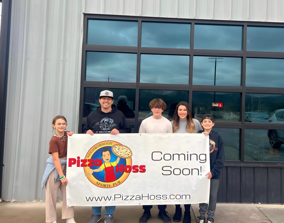 Justin Holmes and his family were excited about opening their third Pizza Hoss location between Powell and Halls.