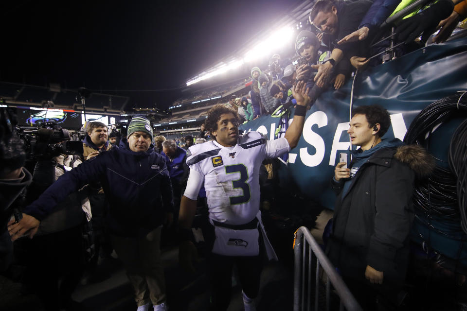 Seattle Seahawks' Russell Wilson greets fans after an NFL wild-card playoff football game against the Philadelphia Eagles, Sunday, Jan. 5, 2020, in Philadelphia. Seattle won 17-9. (AP Photo/Matt Rourke)