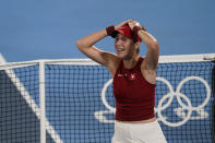 Belinda Bencic, of Switzerland, reacts after defeating Marketa Vondrousova, of the Czech Republic, in the women's gold medal match of the tennis competition at the 2020 Summer Olympics, Saturday, July 31, 2021, in Tokyo, Japan. (AP Photo/Seth Wenig)