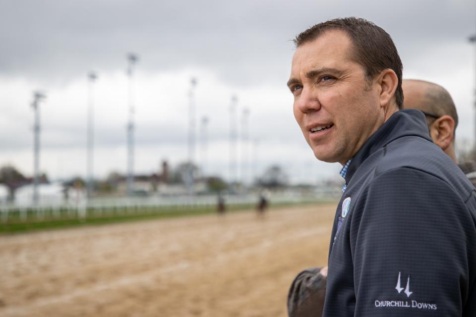 Churchill Downs' equine medical director, Dr. William Farmer, watches morning workouts on the track Monday morning. April 22, 2022