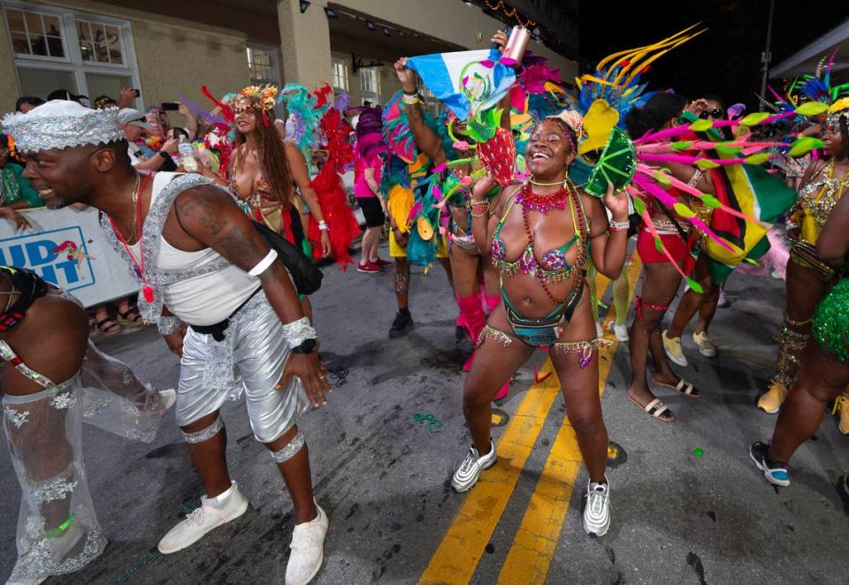 Caribbean dancers make their way down Duval Street Saturday, Oct. 28, 2023, in Key West during the Fantasy Fest Parade.