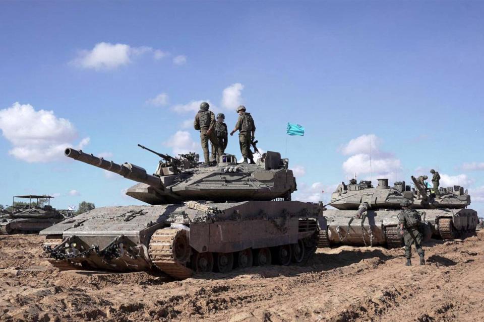 PHOTO: This handout picture released by the Israeli army on May 10, 2024, reportedly shows Israeli soldiers standing atop a main battle tank as part of the Givati Brigade operating in eastern Rafah in the southern Gaza Strip. (Israeli Army Handout via AFP via Getty Images)