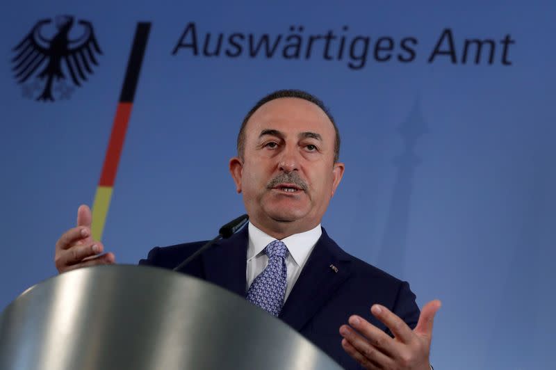 German Foreign Minister Heiko Maas and Turkish Foreign Minister Mevlut Cavusoglu address the media during a joint news conference after a meeting in Berlin