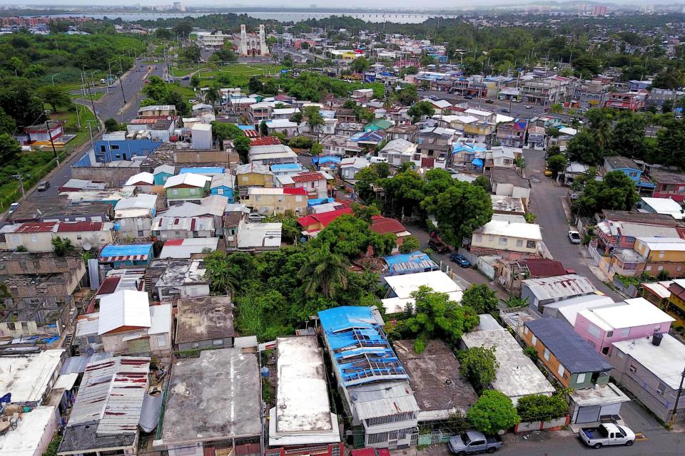 Image: Blue tarps given out by FEMA cover several roofs two years after Hurricane Maria affected the island in San Juan, Puerto Rico, on Sept. 18, 2019. (Ricardo Arduengo / AFP - Getty Images file)