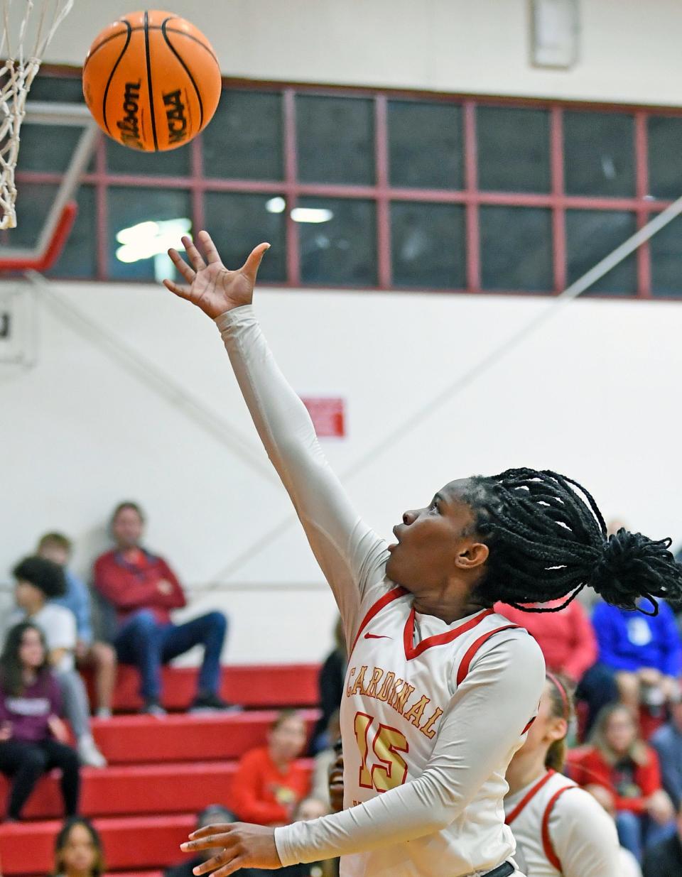 Cardinal Mooney's Sy' Monique Simon (#15) scores two points over Tampa Catholic.Cardinal Mooney Catholic wins 64-40 over the visiting Tampa Catholic on Thursday evening, Feb.22, 2024, winning the Class 3A-Region 3 final at Patterson Pavilion.