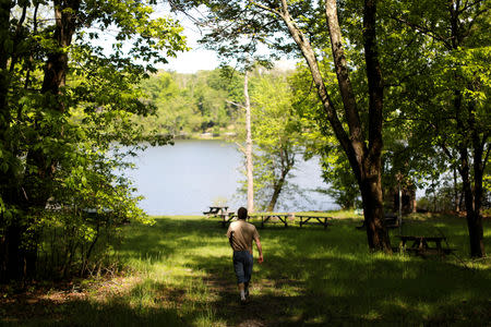 FILE PHOTO: Scott Rosmarin, owner and operator of Rosmarins Day Camp and Cottages, walks on the camp's grounds in Monroe, New York, U.S., May 20, 2019. Picture taken May 20, 2019. REUTERS/Mike Segar