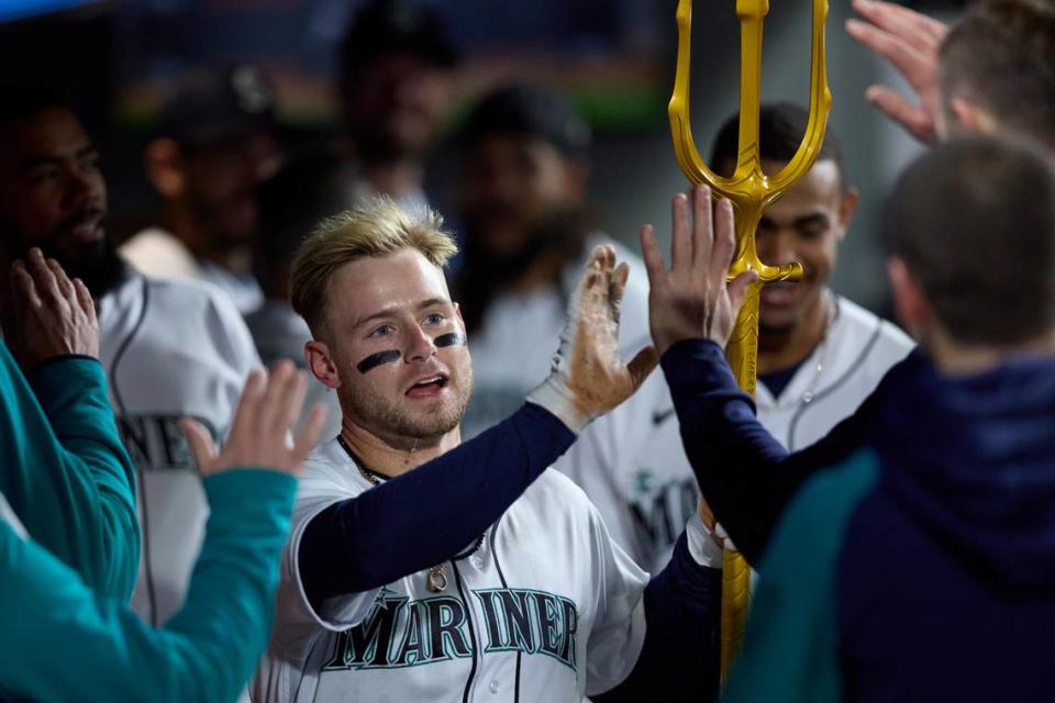 Seattle Mariners’ Jarred Kelenic celebrates his solo home run hit on a pitch from St. Louis Cardinals starting pitcher Miles Mikolas during a baseball game, Saturday, April 22, 2023, in Seattle. (AP Photo/John Froschauer)