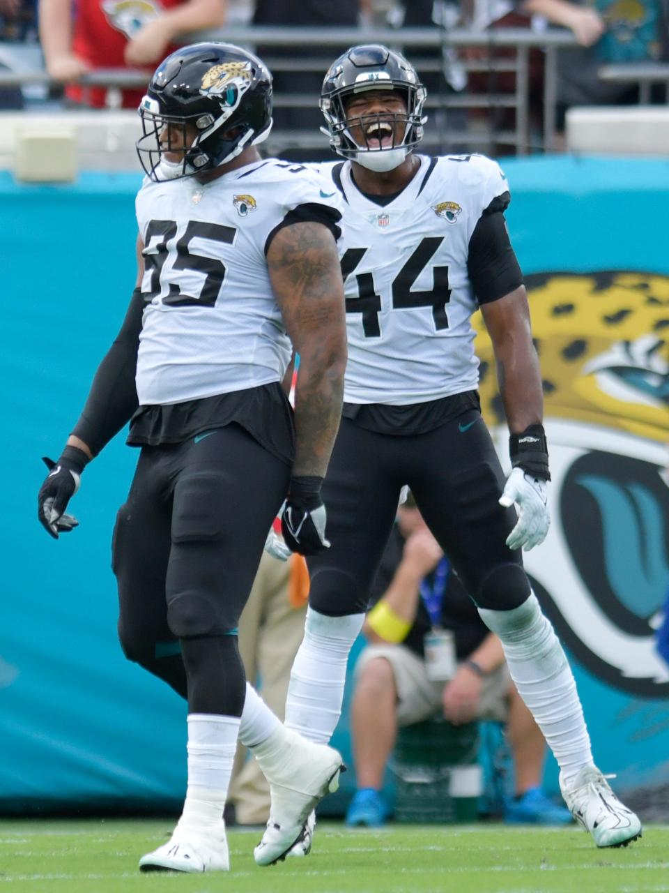 Jacksonville Jaguars linebacker Travon Walker (44) yells in celebration after teammate defensive end Roy Robertson-Harris (95) sacked Indianapolis Colts quarterback Matt Ryan (2) during early fourth quarter action. The Jaguars went into the first half with a 17 to 0 lead over the Colts and went on to win the game 24 to 0. The Jacksonville Jaguars hosted the Indianapolis Colts at TIAA Bank field in Jacksonville, FL Sunday, September 18, 2022. [Bob Self/Florida Times-Union]