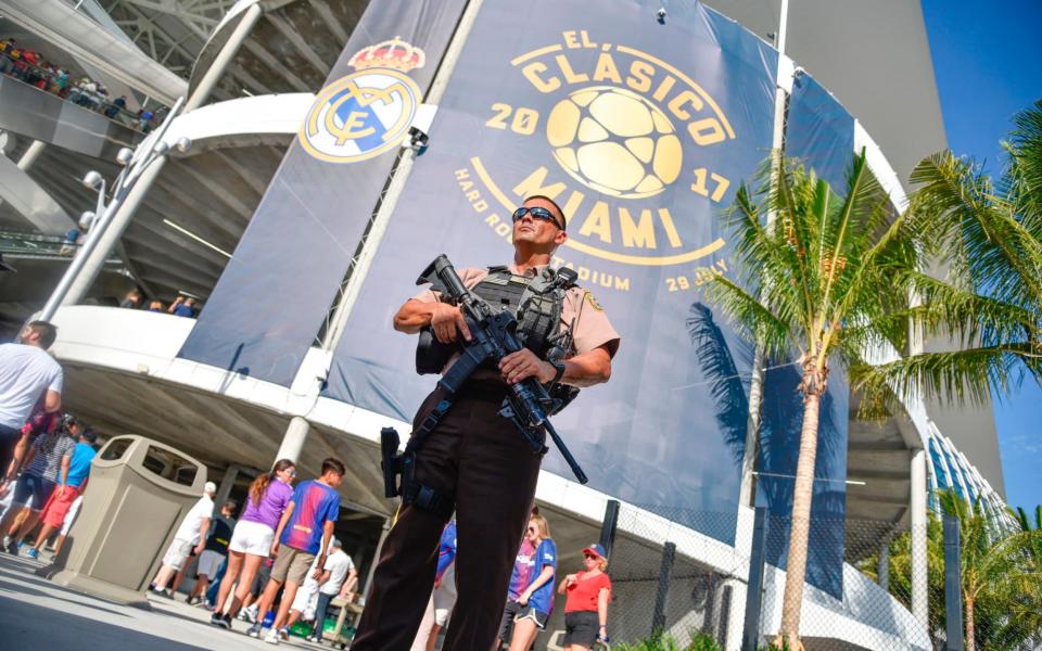 Miami Dade Police officer Jackie Yuen keeps watch before the Real Madrid vs Barcelona at the International Champions Cup friendly match at Hard Rock Stadium in Miami, Florida, on July 29, 2017 - Credit: AFP