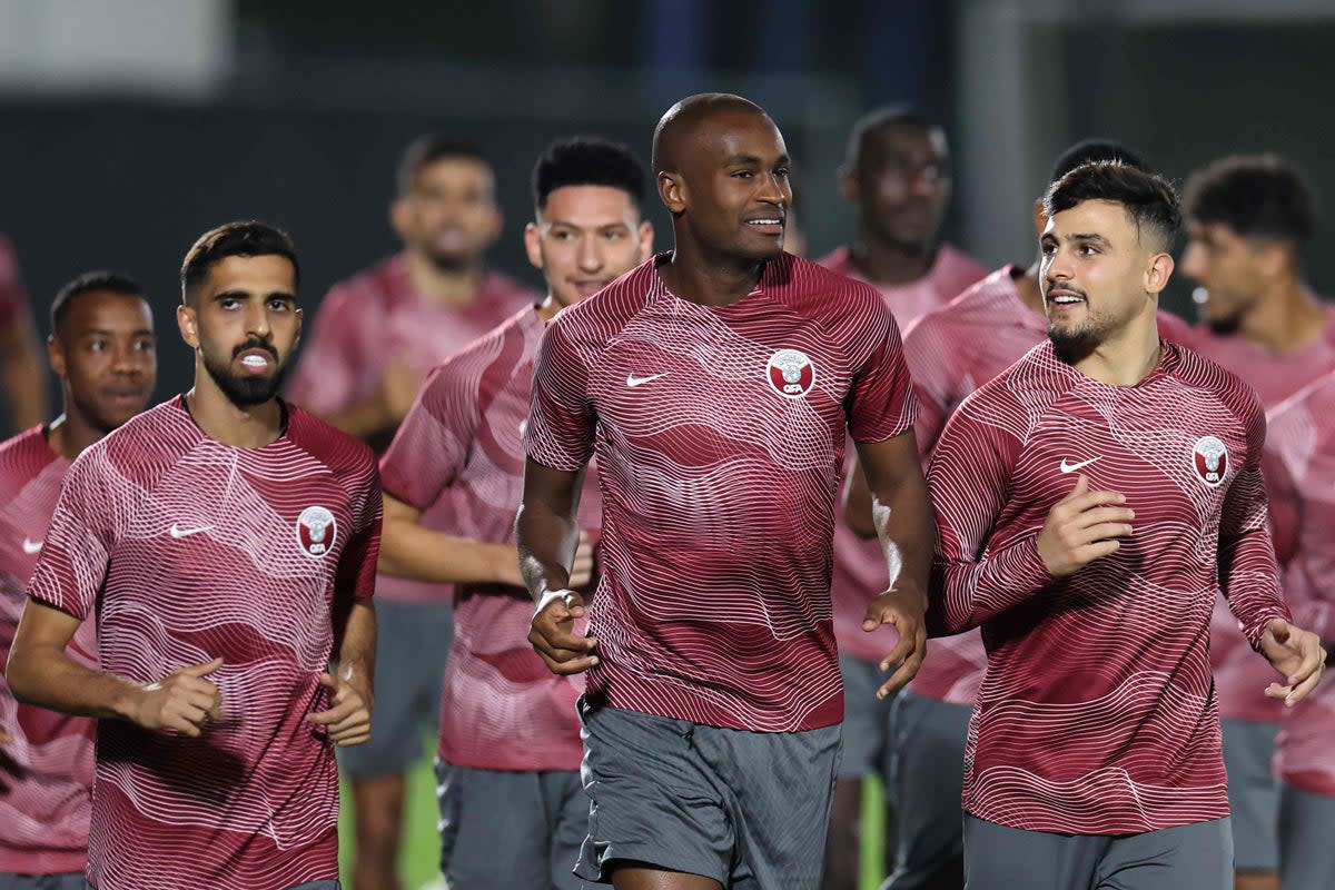 Qatar defender Karim Hassan Abdel, centre, trains on the eve of the World Cup (AFP via Getty Images)